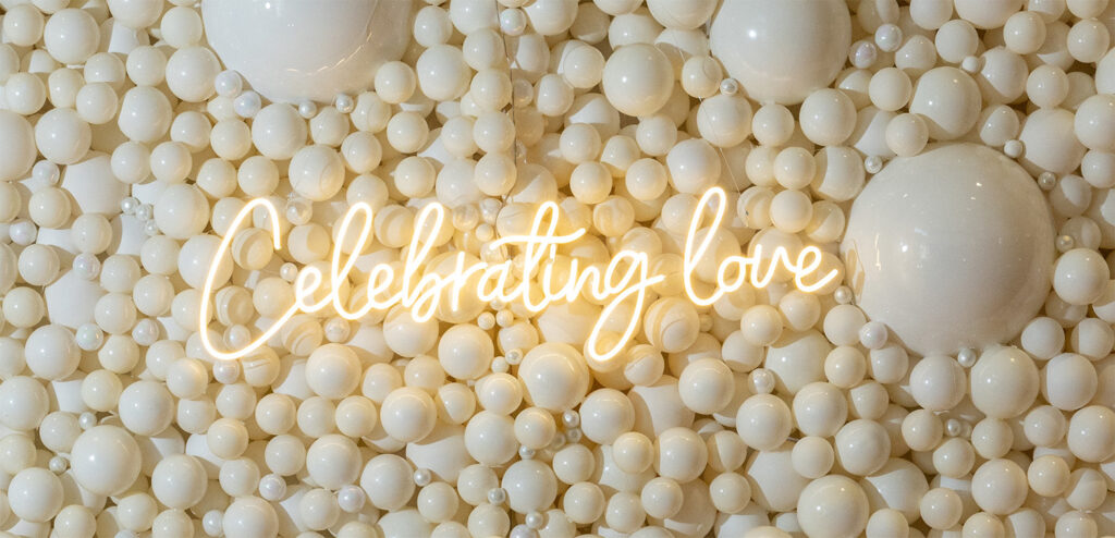 celebrating love neon sign